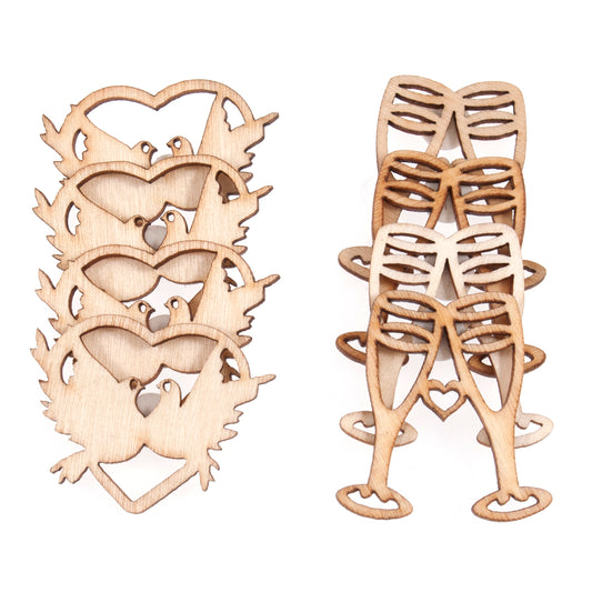 Natural wooden wedding embellishments showing hearts with doves and champagne glasses
