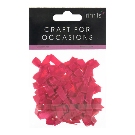 Small bright pink satin ribbon bows