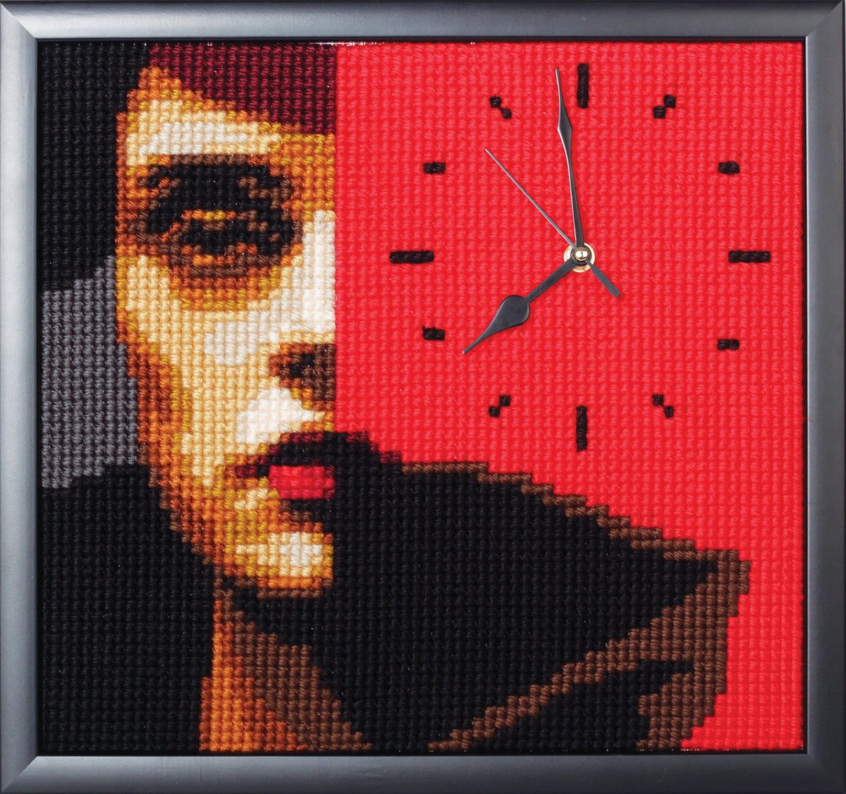 Stitched red and black portrait design with a clock face, shown framed