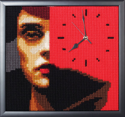 Stitched red and black portrait design with a clock face, shown framed
