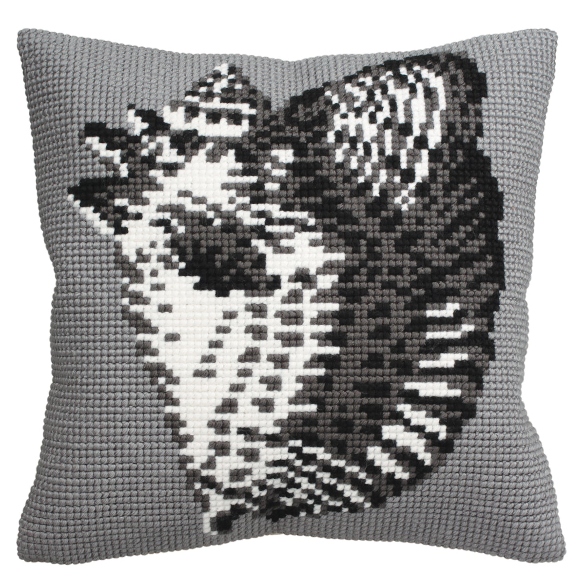 Cross stitch cushion design featuring a seashell