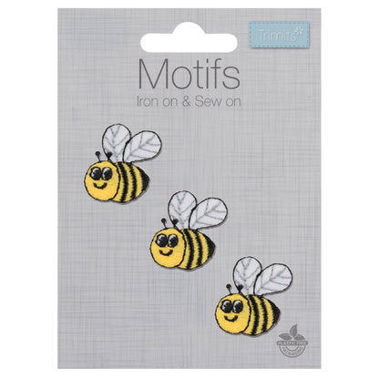 Three small embroidered yellow and black bee motifs