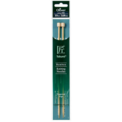 Pair of Clover Takumi bamboo knitting needles, 23cm x 3.25mm, in green packaging