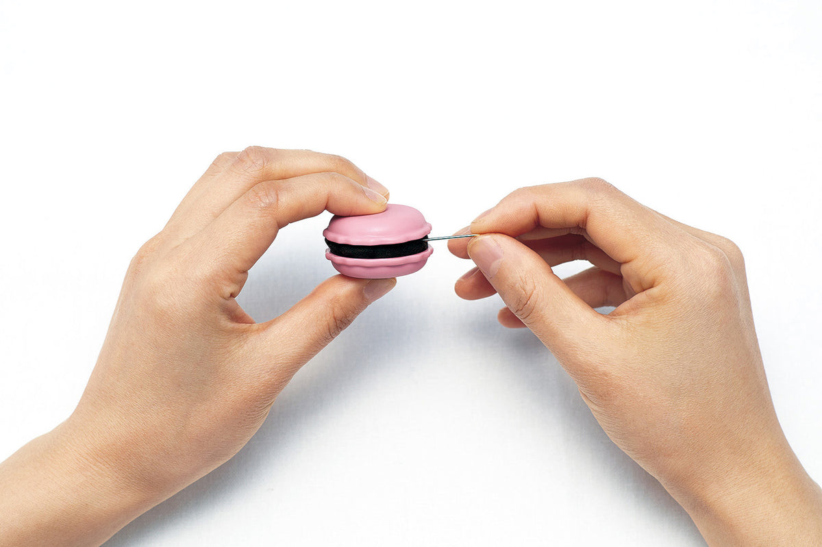 Raspberry coloured Clover macaron needle sharpener