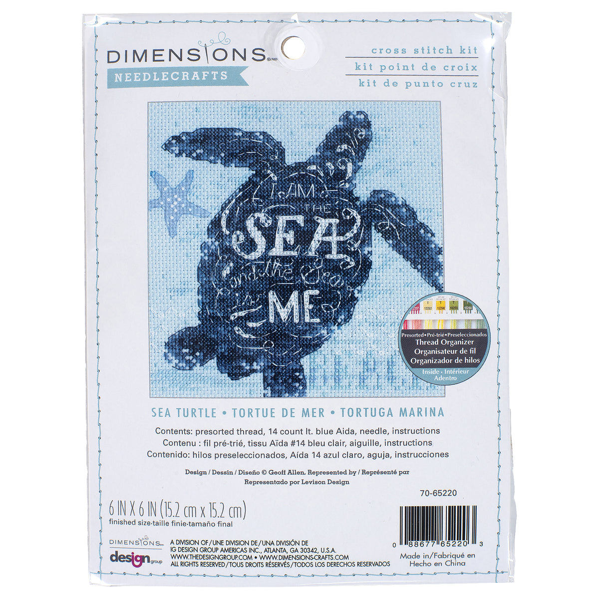 Finished sea turtle cross stitch on blue fabric