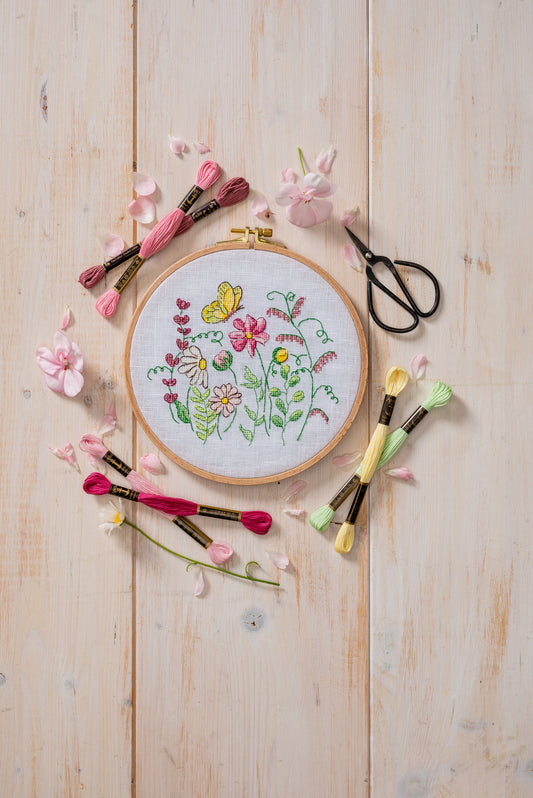 Anchor Wild Flowers cross stitch design in an embroidery hoop