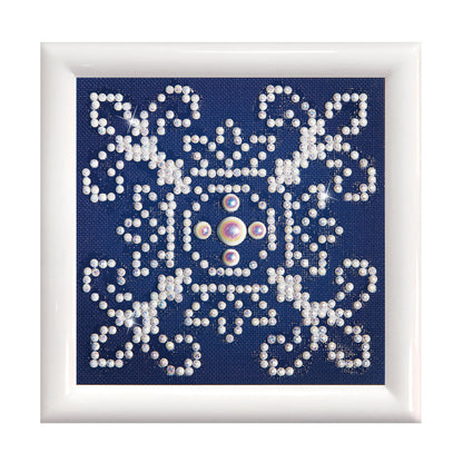 Diamond Dotz White on Blue diamond painting kit with frame showing a white on blue design