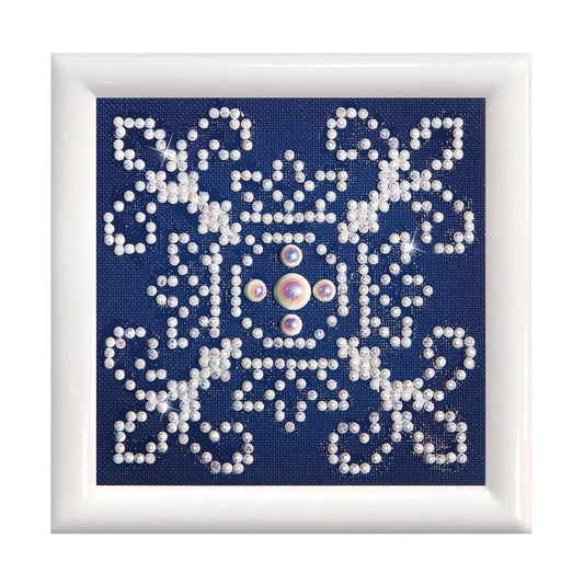 Diamond Dotz White on Blue diamond painting kit with frame showing a white on blue design