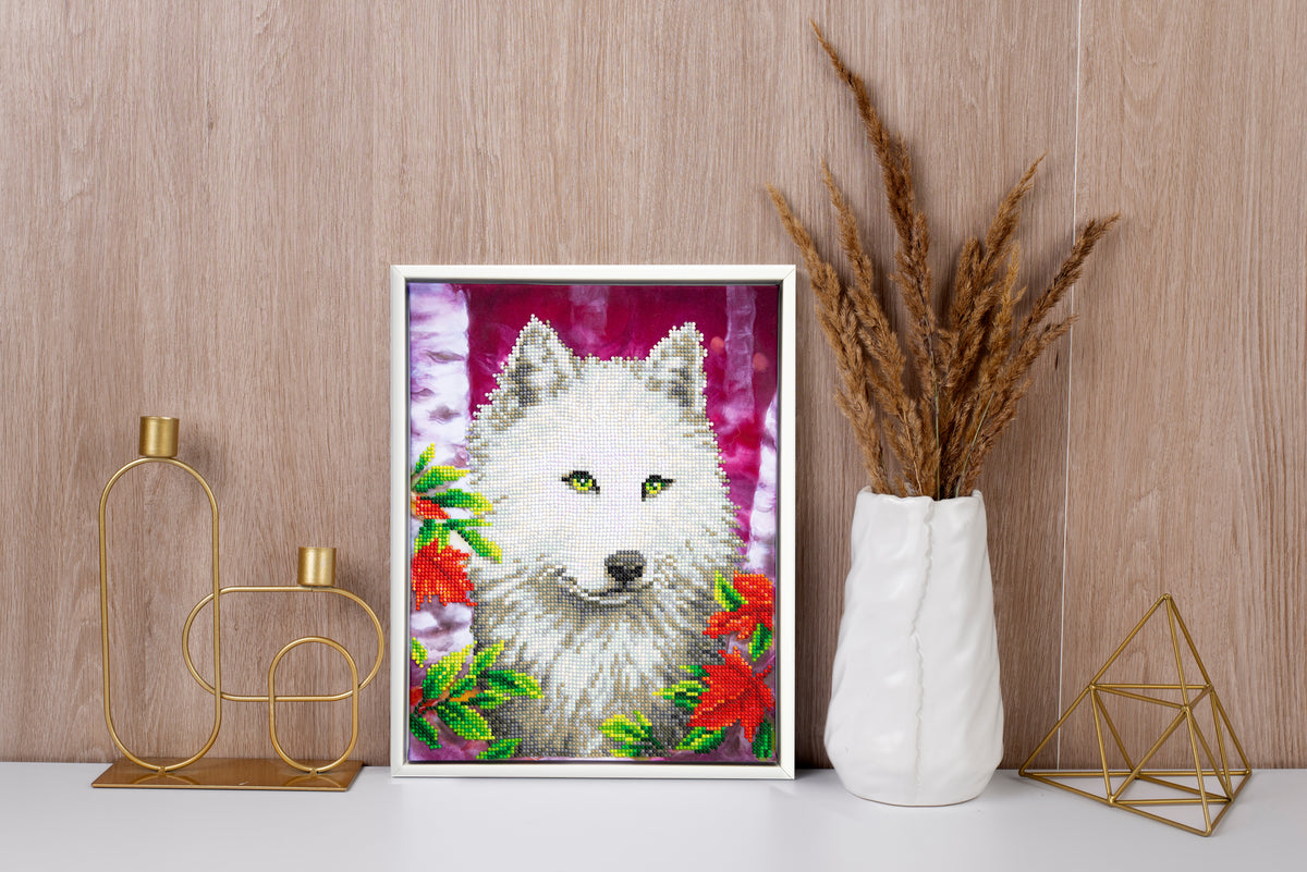 Diamond painting design of a white wolf with green eyes