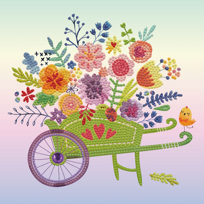 Diamond painting design of a wheelbarrow filled with colourful flowers