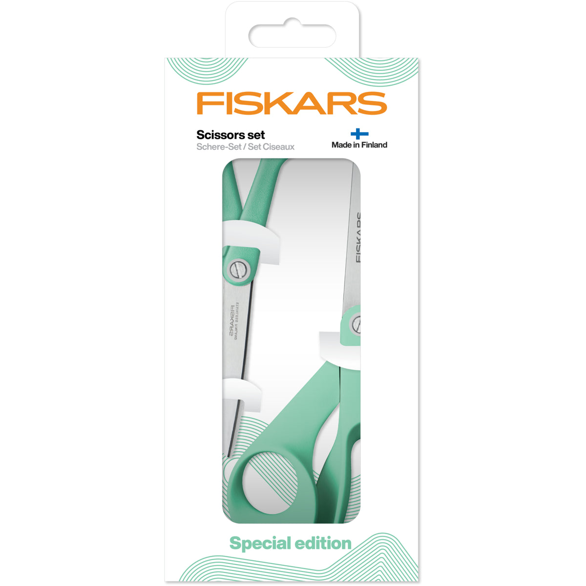 Two Fiskars scissors with mint green handles