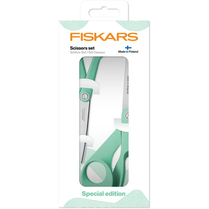 Two Fiskars scissors with mint green handles