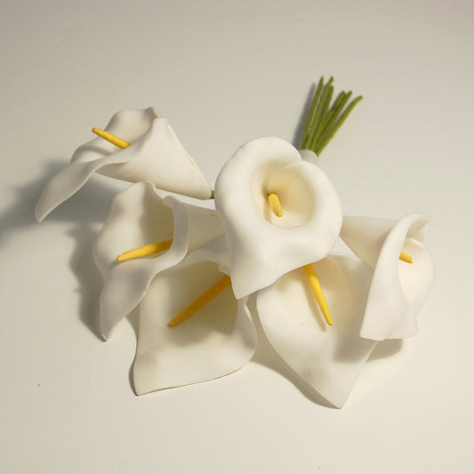 Spray of six white foam calla lilies