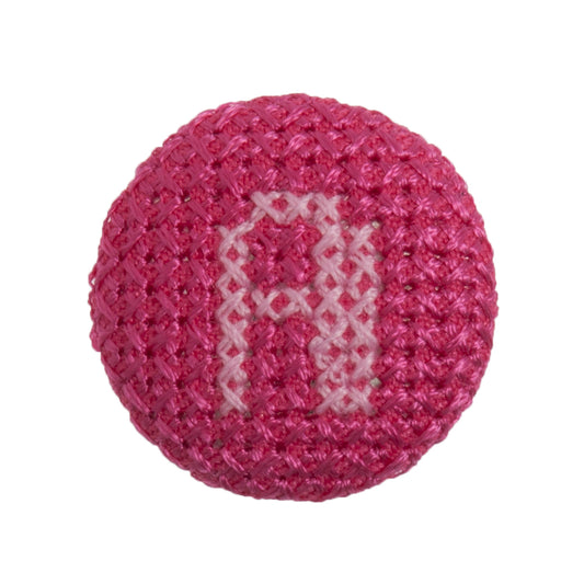 Round button with a fuchsia cross stitch letter A
