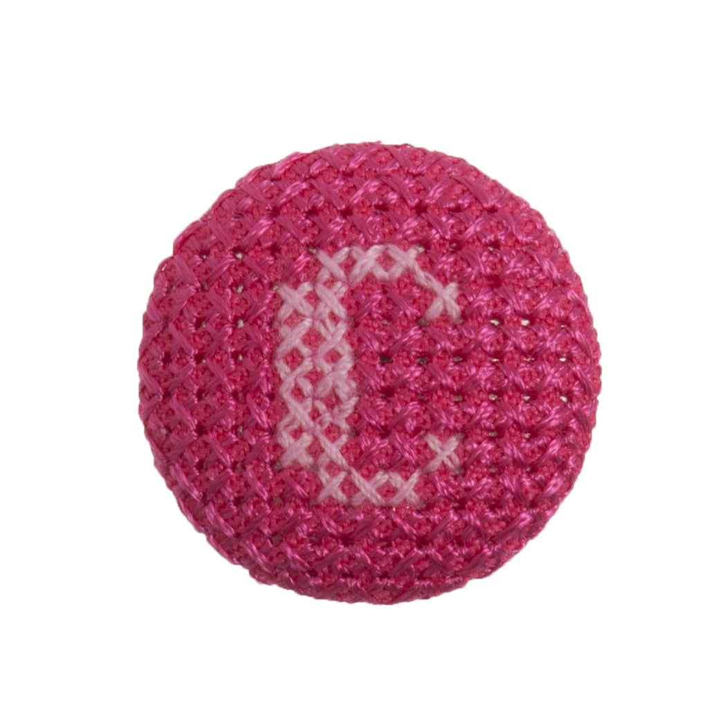 Round button with a fuchsia cross stitch letter C