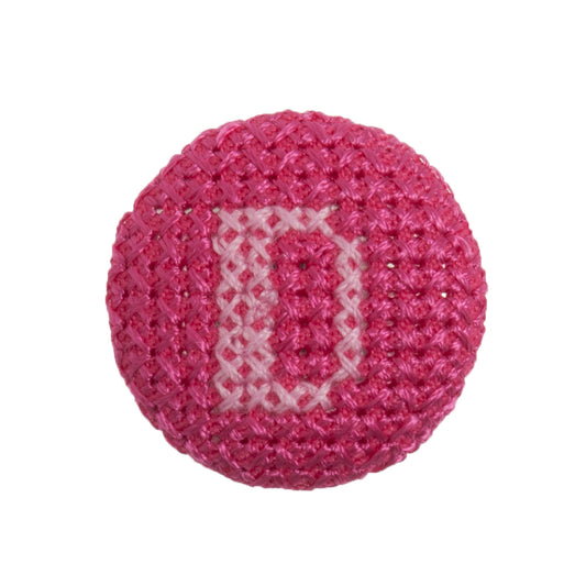 Round button with a fuchsia cross stitch letter D