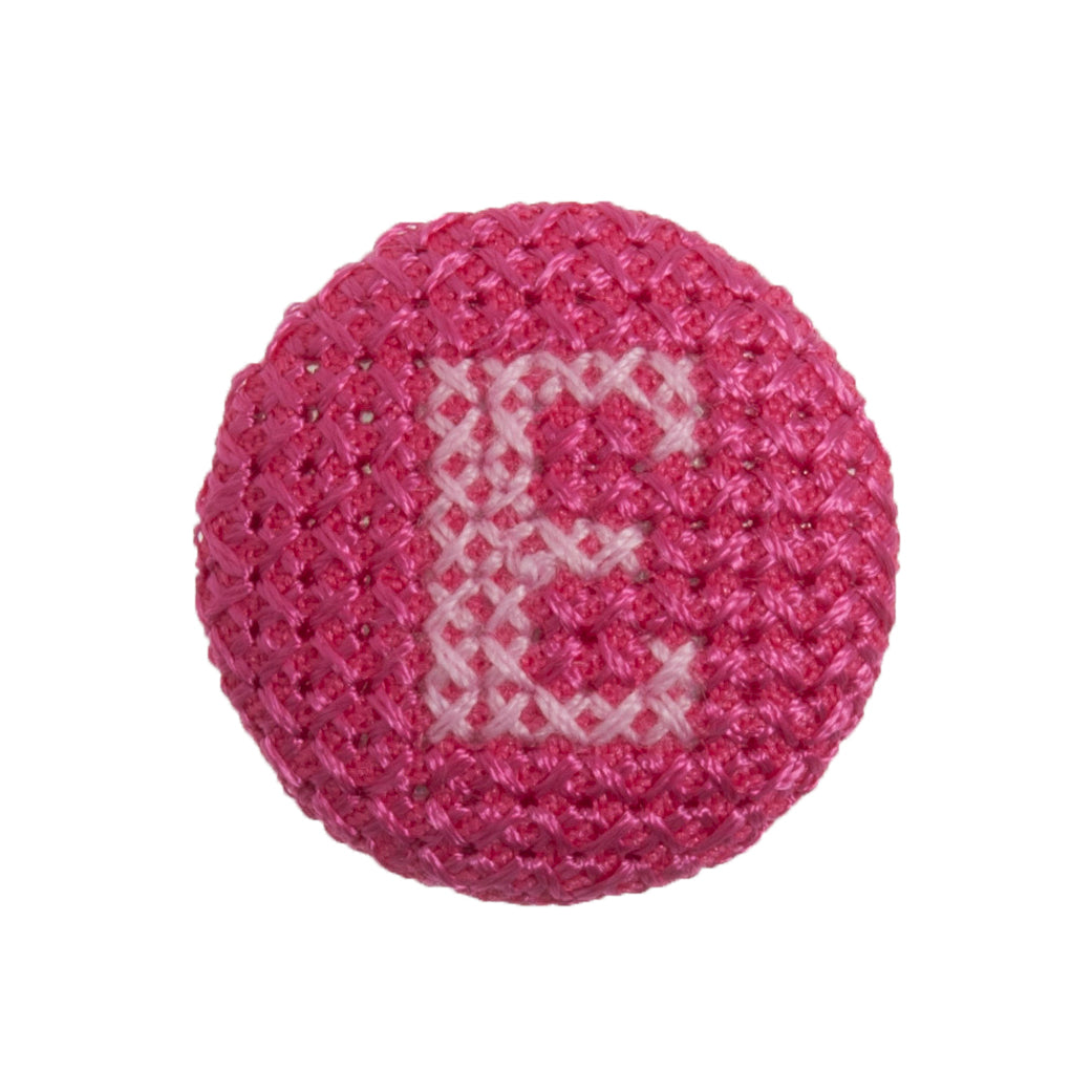 Round button with a fuchsia cross stitch letter E