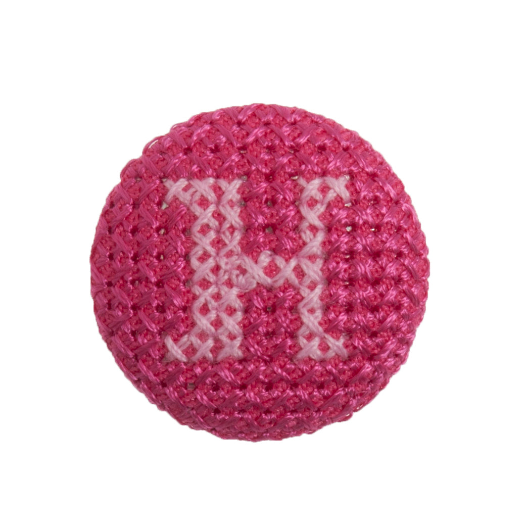 Round button with a fuchsia cross stitch letter H