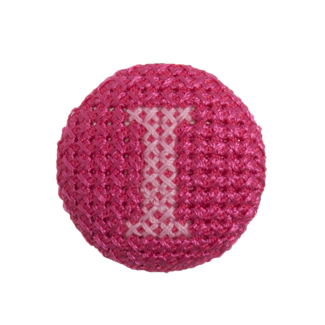Round button with a fuchsia cross stitch letter I