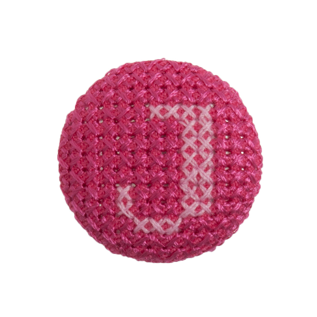 Round button with a fuchsia cross stitch letter J
