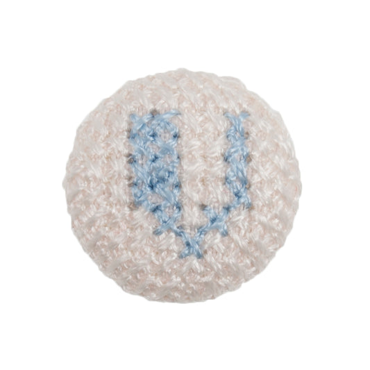 White fabric-covered button with a light blue cross-stitched letter V