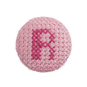 Pink fabric-covered button with a darker pink cross-stitched letter R