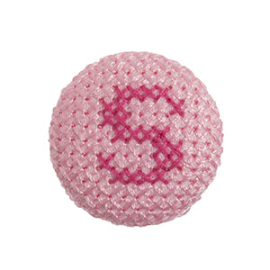 Pink fabric-covered button with a darker pink cross-stitched letter S