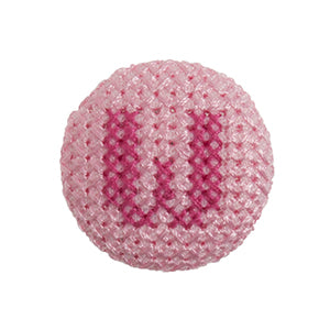 Pink fabric-covered button with a darker pink cross-stitched letter W