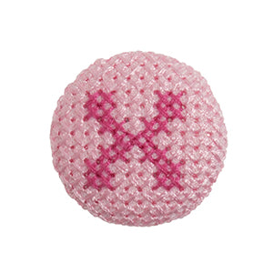 Pink fabric-covered button with a darker pink cross-stitched letter X