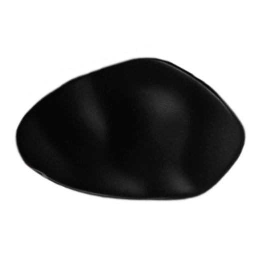 Matt black hammered metal button with an irregular shape