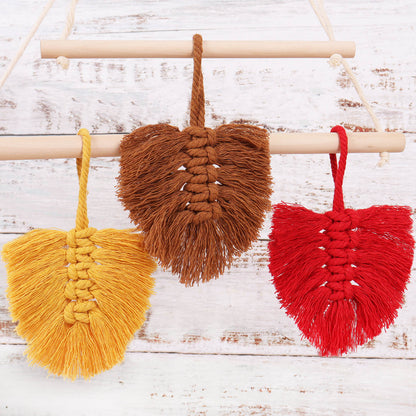 Three macrame autumn leaf decorations
