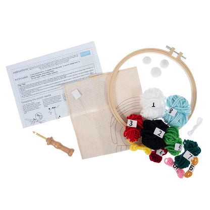 Christmas penguin punch needle design in a hoop