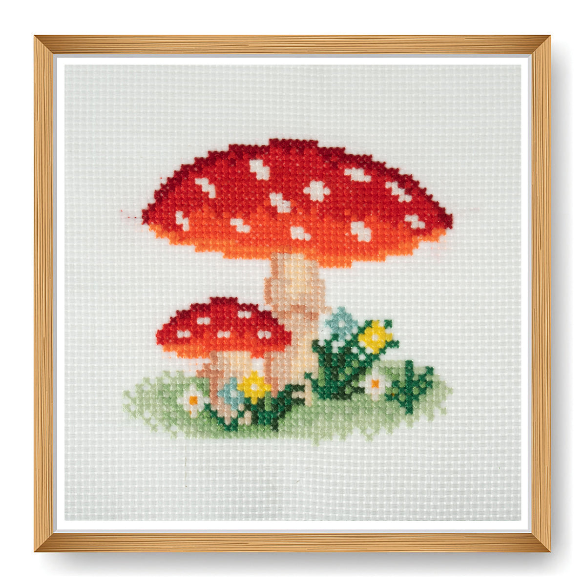 Trimits mini cross stitch kit showing a red spotted toadstool