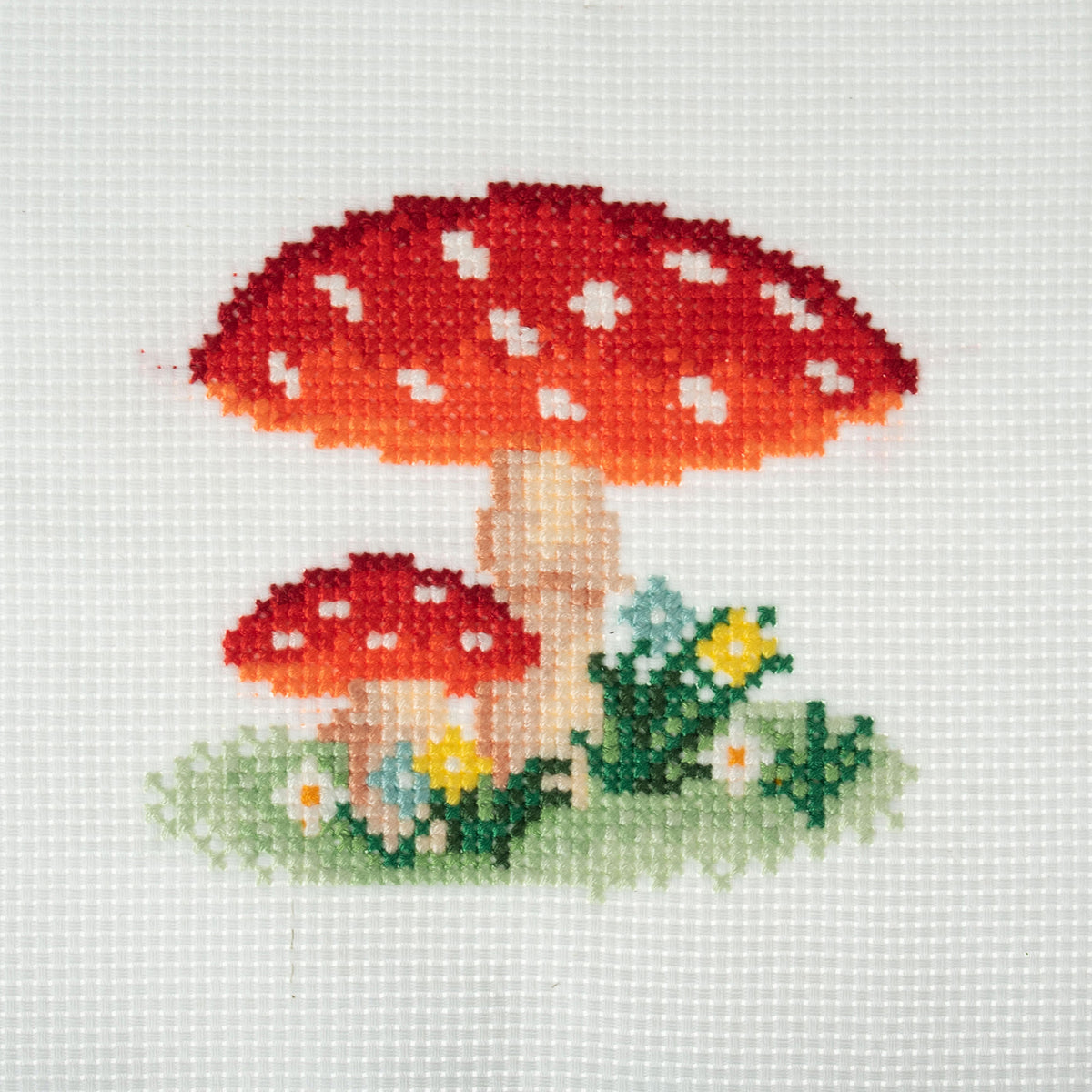 Trimits mini cross stitch kit showing a red spotted toadstool