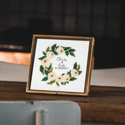 Trimits mini cross stitch kit showing a celebration wreath