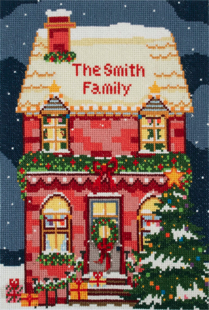 Trimits Festive House cross stitch kit packaging showing the finished design