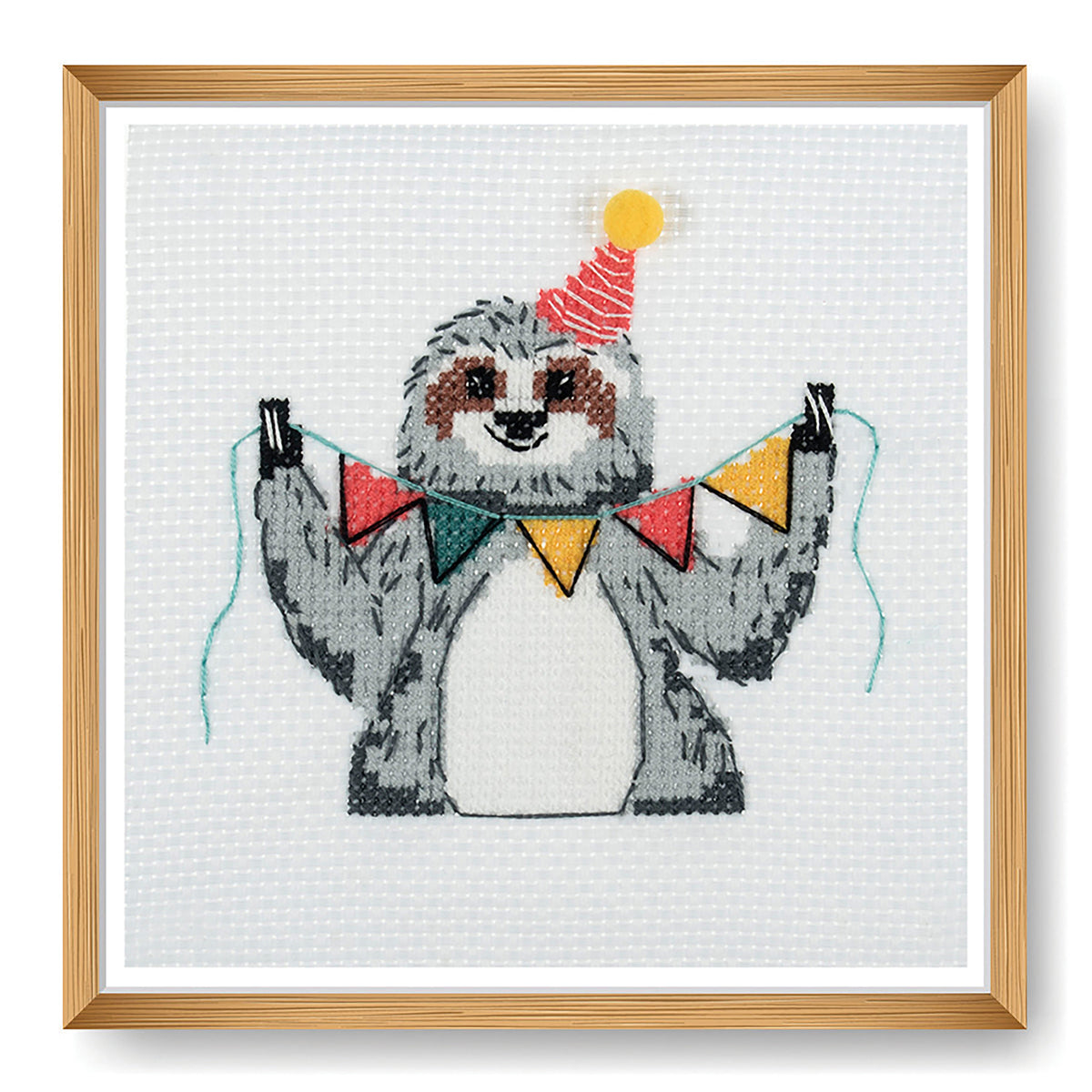 Trimits mini cross stitch kit showing a smiling sloth