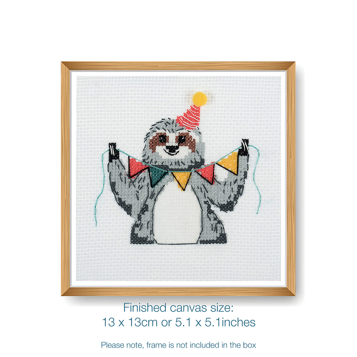 Trimits mini cross stitch kit showing a smiling sloth