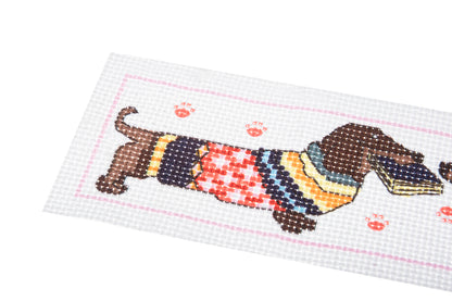 Trimits cross stitch bookmark kit showing a dachshund wearing a cosy jumper