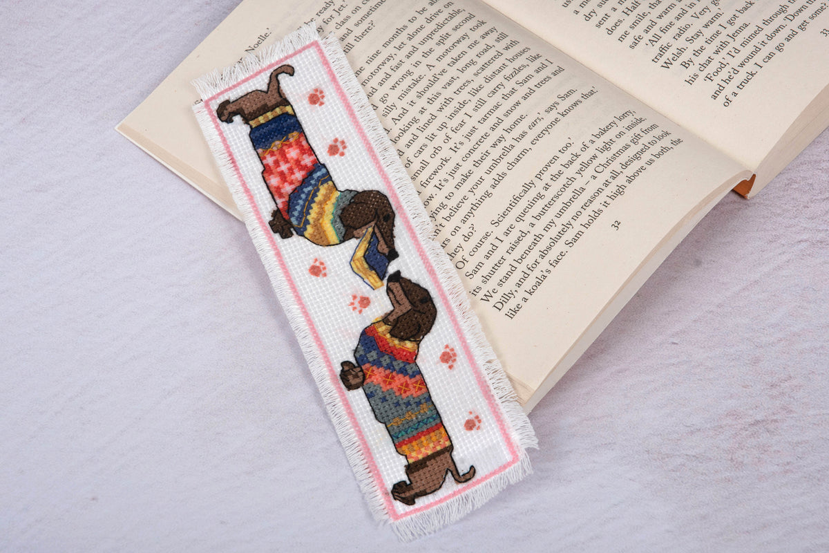 Trimits cross stitch bookmark kit showing a dachshund wearing a cosy jumper