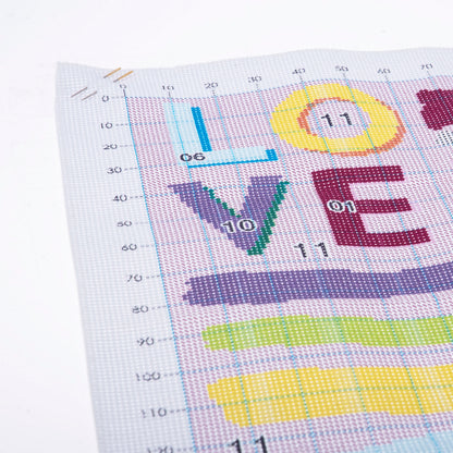 Trimits Love cross stitch kit packaging showing the finished design