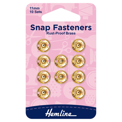 10 gold Hemline 11mm sew-on snap fasteners on card