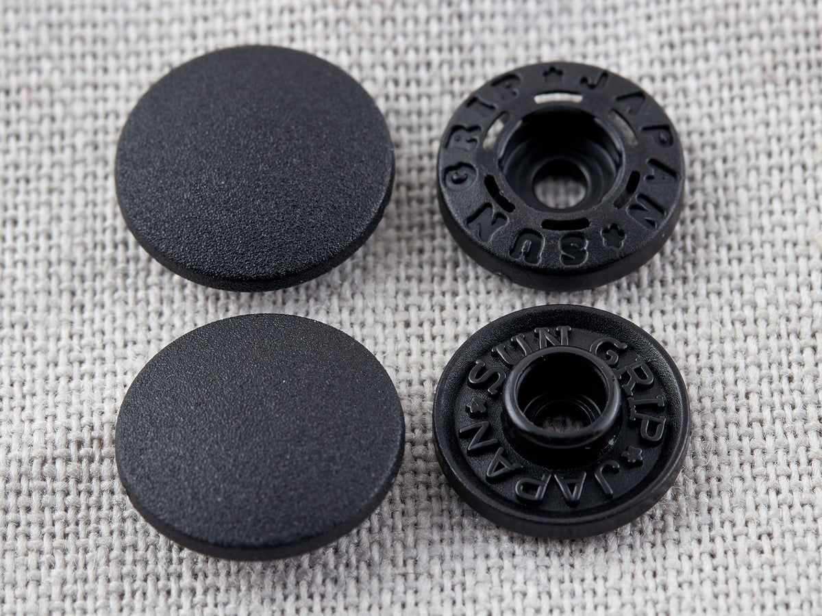 Tub of black Hemline 13mm tool-less plastic snaps
