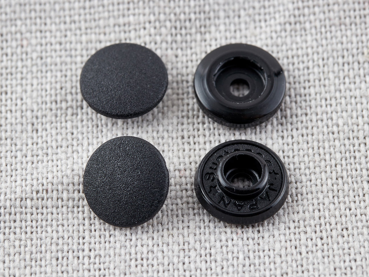 Pack of black 9mm plastic snap fasteners
