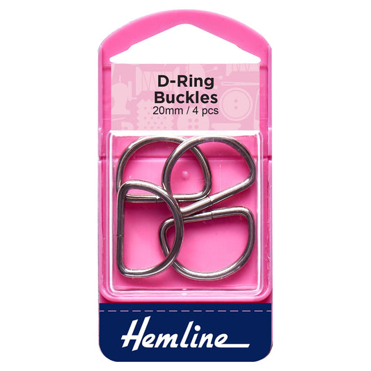 Four nickel metal D rings on a Hemline card