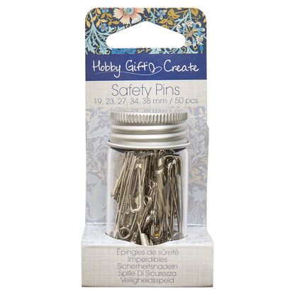 Glass jar of assorted silver safety pins