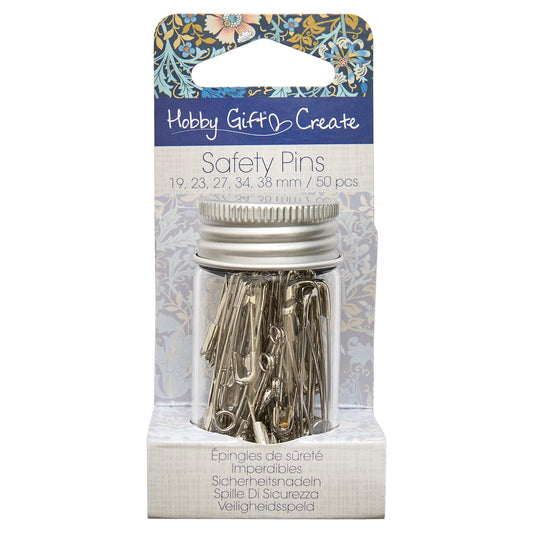 Glass jar of assorted silver safety pins