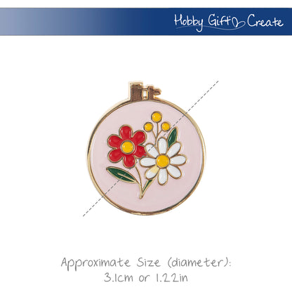 Round enamel magnetic needle minder with a colourful enamel embroidery hoop design with bright floral detailing