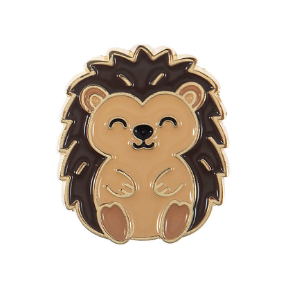 Round enamel magnetic needle minder with an enamel hedgehog design in warm brown and cream