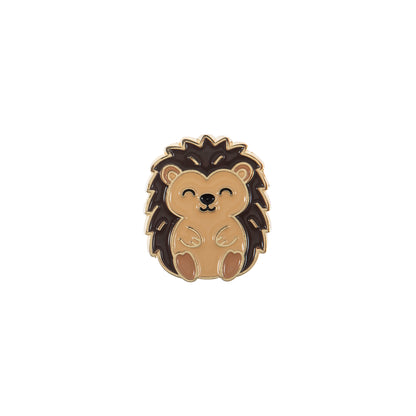 Round enamel magnetic needle minder with an enamel hedgehog design in warm brown and cream